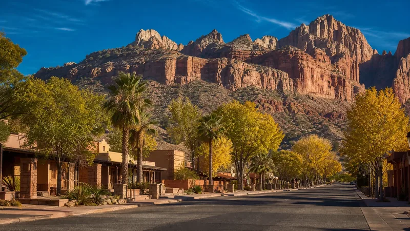 Desert town main street with low buildings and red sandstone cliffs behind, Washington County Utah Business License